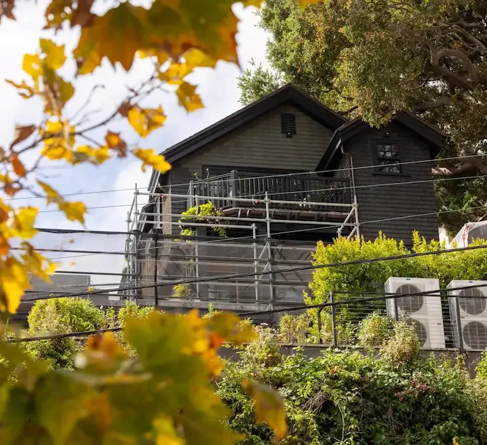 Residential home in Berkeley with scaffolding setup for exterior renovation and maintenance project