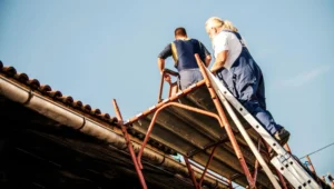 Workers using scaffolding for roof repair in Berkeley with safe and stable elevated platform access