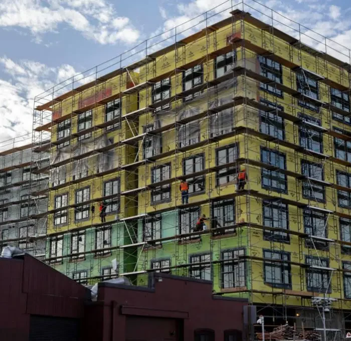 Large commercial scaffolding system installed on building construction site for safe worker access in Berkeley